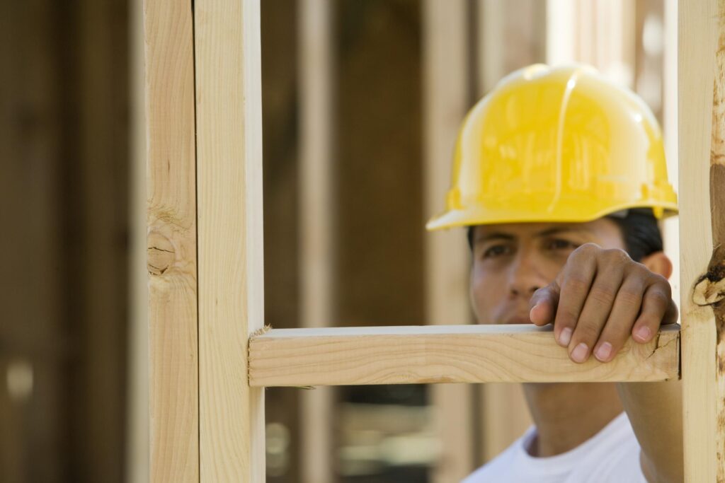man holding the wood frame