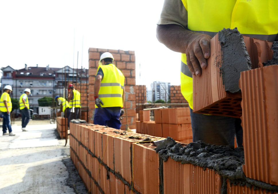 man stuffing the cement
