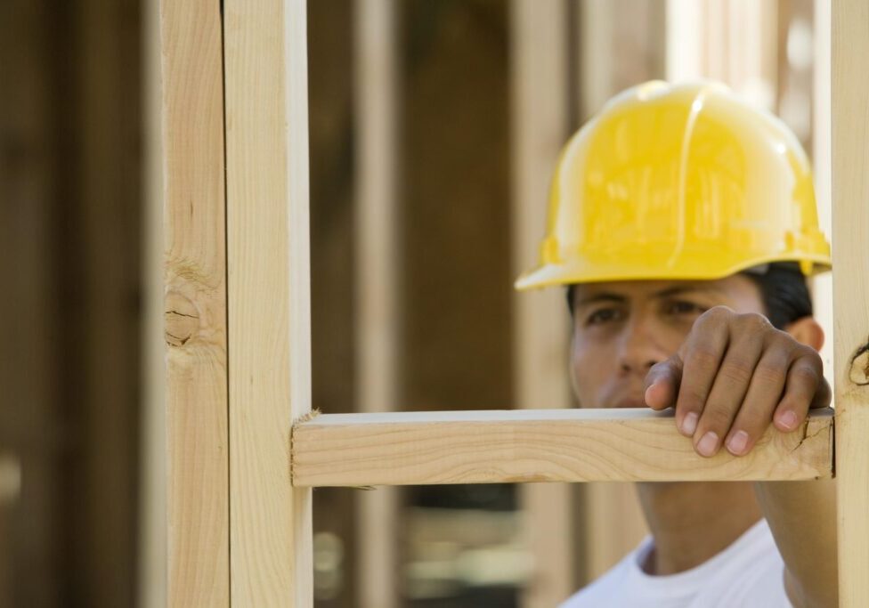man holding the wood frame