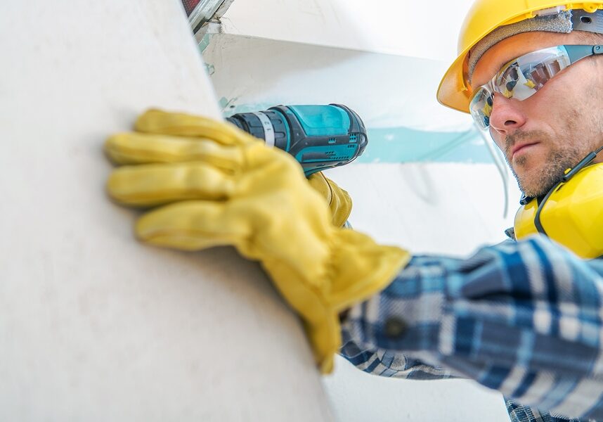 man drills the wall